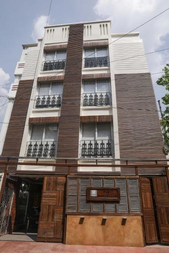 a building with balconies on the side of it at The Mandeville in Kolkata