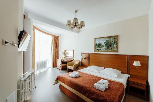 Ένα ή περισσότερα κρεβάτια σε δωμάτιο στο Hotel Complex Lubim