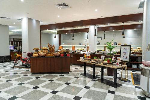 a store with a buffet of food on display at Park Inn by Radisson Makkah Al Naseem in Makkah