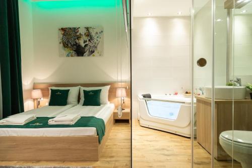 two pictures of a bedroom with a bed and a bathroom at Royal Suites in Belgrade