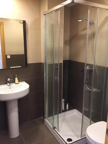 a bathroom with a shower and a sink at Ático Jaca Ciudadela in Jaca