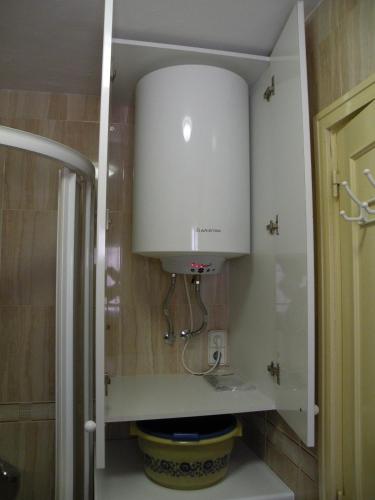 a bathroom with a sink and a white cabinet at Ducado - Fincas Arena in Benidorm