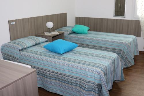 Ein Bett oder Betten in einem Zimmer der Unterkunft B&B Incanto Salento