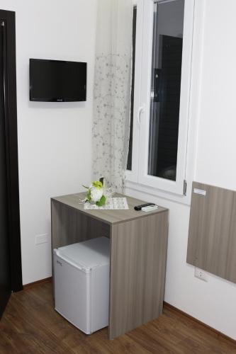 TV a/nebo společenská místnost v ubytování B&B Incanto Salento