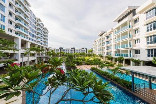 an image of an apartment complex with a swimming pool at HOMESTAY @ BANDAR SERI PUTRA KAJANG in Kajang