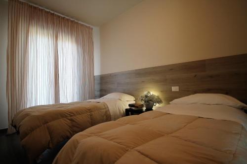 Katil atau katil-katil dalam bilik di Residence Felice