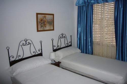 Postel nebo postele na pokoji v ubytování Edimar - Fincas Arena