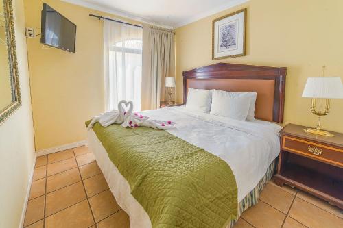 Postel nebo postele na pokoji v ubytování Aparthotel Serena Dream