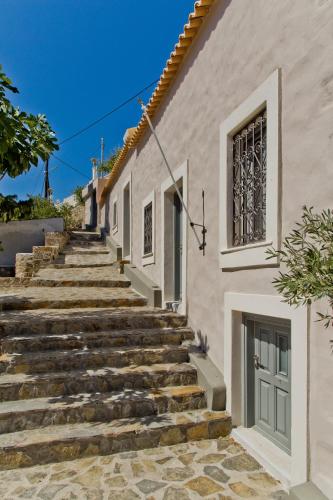 a set of stairs leading up to a building at Casa Metropolis in Apérion