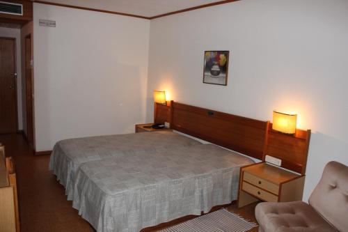 Кровать или кровати в номере Hotel Bom Sucesso