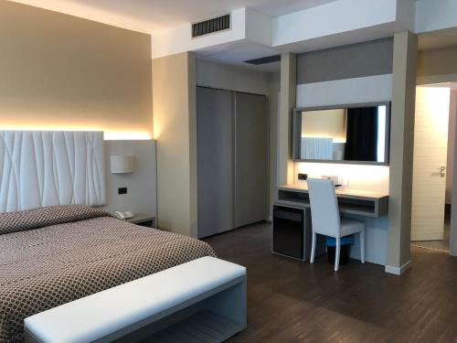 Posteľ alebo postele v izbe v ubytovaní Hotel Enrichetta