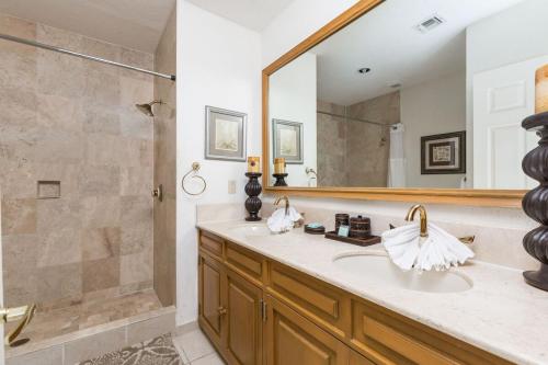 a bathroom with a shower and a sink and a mirror at Sonoran Sea 2BR SSE 605 by Casago in Puerto Pe&ntilde;asco