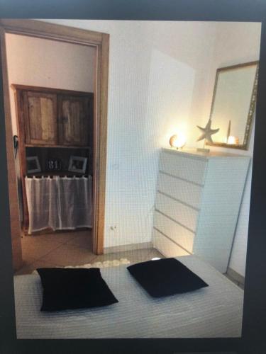 a room with two mats on the floor and a mirror at Jesolo pineta oasi verde ,spiaggia e mare in Lido di Jesolo