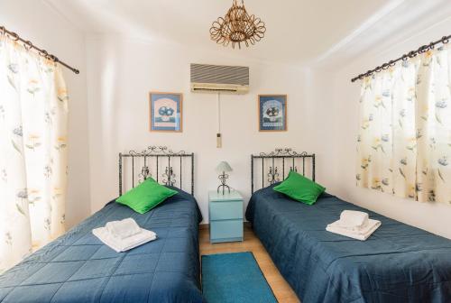 Katil atau katil-katil dalam bilik di Quinta Vita - Vila Limao