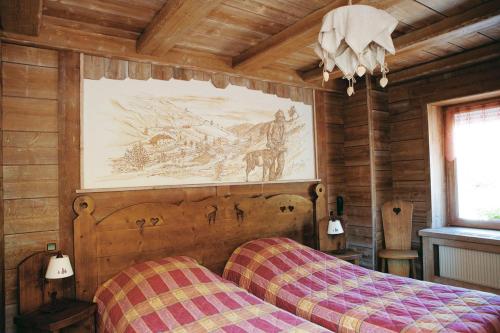 Llit o llits en una habitació de Auberge des Skieurs