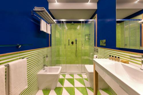 a bathroom with a shower and a sink and a toilet at Casa Dominova de Luxe in Sorrento