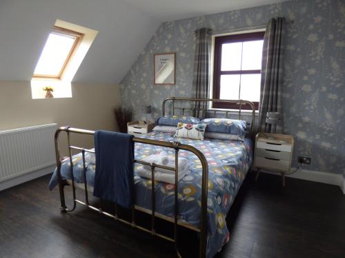 Postel nebo postele na pokoji v ubytování Ornum Self Catering Cottage