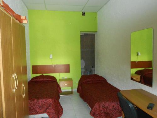 Katil atau katil-katil dalam bilik di HOTEL 25 DE MAYO