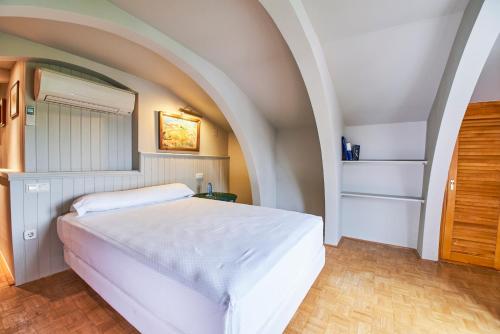 Ένα ή περισσότερα κρεβάτια σε δωμάτιο στο Sotopalacio HSR
