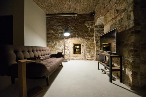 a living room filled with furniture and a fire place at Old Central Apartment in Cluj-Napoca