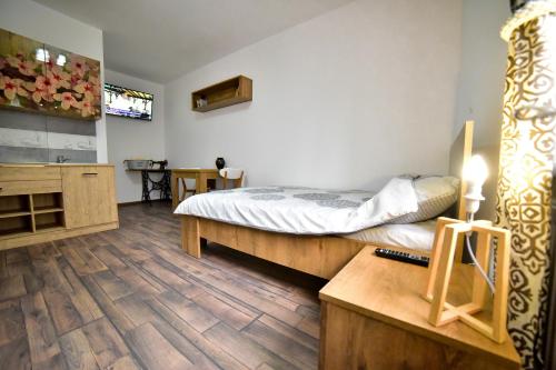 Ένα ή περισσότερα κρεβάτια σε δωμάτιο στο FLH - Central Apartments