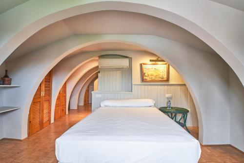 Tempat tidur dalam kamar di Sotopalacio HSR