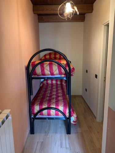 a bedroom with a bunk bed in a room at Agriturismo Campolungo in Cutigliano