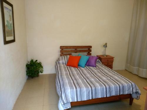 Łóżko lub łóżka w pokoju w obiekcie Tu casa Oaxaca...