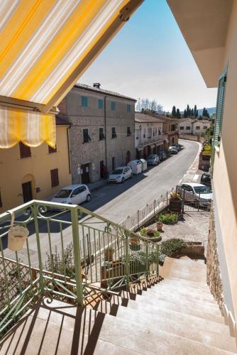 a balcony with a view of a street at MADI' casa vacanze in Laiatico