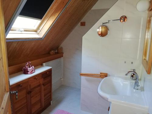 a bathroom with a sink and a window at Pech Cujoul in Gourdon