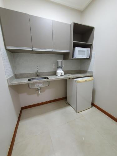 Η κουζίνα ή μικρή κουζίνα στο Guaratur Hotel