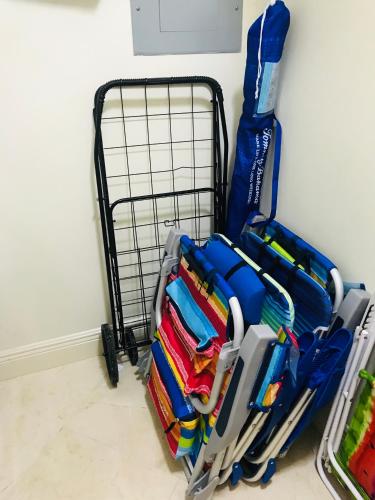 a rack of folded shirts sitting next to a wall at The King David Condos in Miami Beach