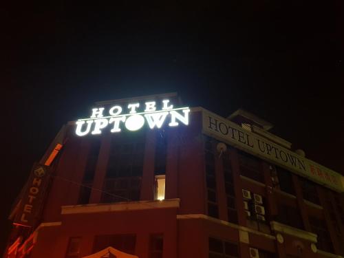 a hotel uptown sign on the top of a building at Uptown Hotel Kajang in Kajang