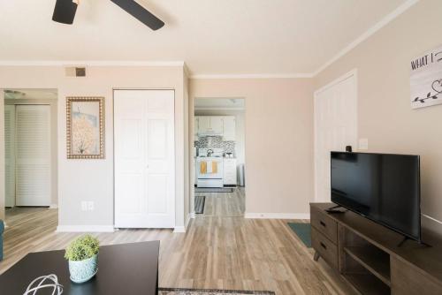 a living room with a flat screen tv at Cute Condo in Rock Hill-45 in Rock Hill