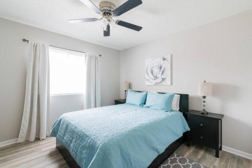 a bedroom with a bed with a ceiling fan at Cute Condo in Rock Hill-45 in Rock Hill