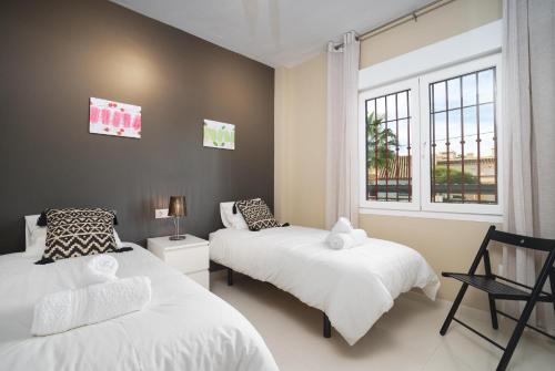 Cama o camas de una habitación en El Palmeral II