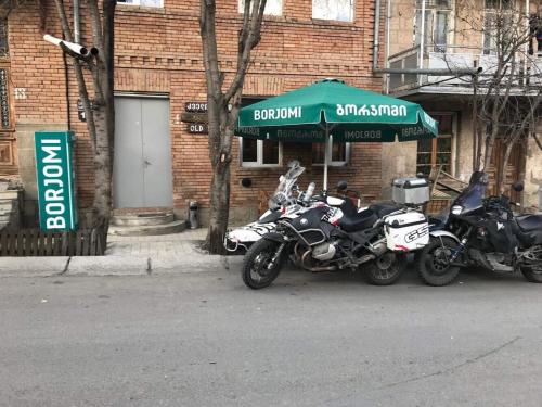 two motorcycles parked in front of a building at Old House in Akhaltsikhe