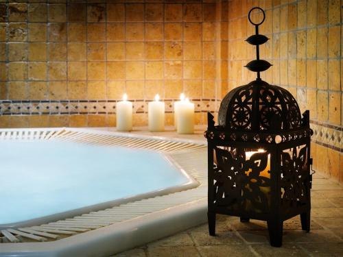 a room with candles and a bed with a lantern at Ria Park Garden Hotel in Vale do Lobo