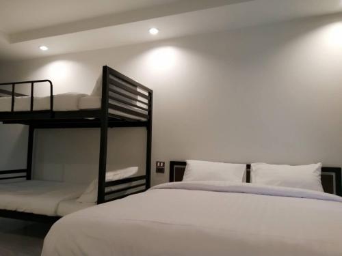 Ένα ή περισσότερα κρεβάτια σε δωμάτιο στο Richmond Nan Hotel
