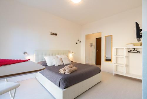 Кровать или кровати в номере Alessia's Flat- Milano M3 Corvetto