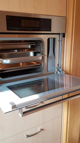 a kitchen with an oven with a counter top at Ferienwohnung Manuela in Adnet