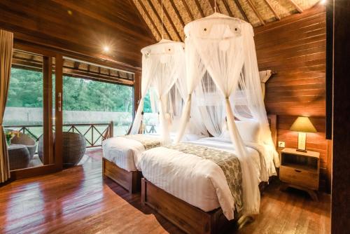 Mamamia Island Villa tesisinde bir odada yatak veya yataklar