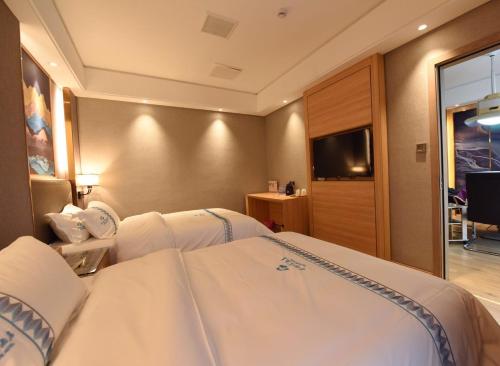 TV a/nebo společenská místnost v ubytování Mushanhe Hotel