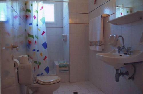a bathroom with a toilet and a sink at Angela's in Galissas