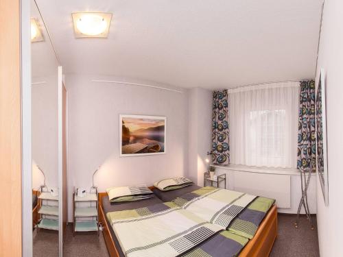 Katil atau katil-katil dalam bilik di Ferienwohnung Bergzauber - Chiemgau Karte