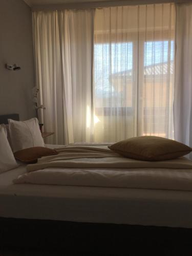 Dietrichsteinerhof Apartments & Roomsにあるベッド