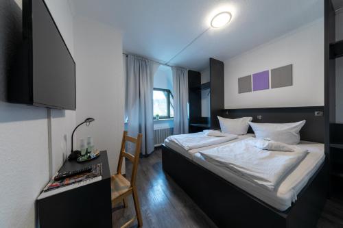 Postel nebo postele na pokoji v ubytování Hotel Central