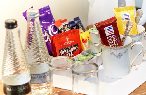 a counter with cups and other food and drinks at White Horse Farm Inn in Pickering
