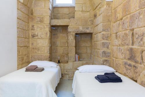 Ένα ή περισσότερα κρεβάτια σε δωμάτιο στο Casa Florean Centro Storico Lecce