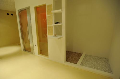 a bathroom with a shower and a glass door at Haus im Erlengrund in Coldrano